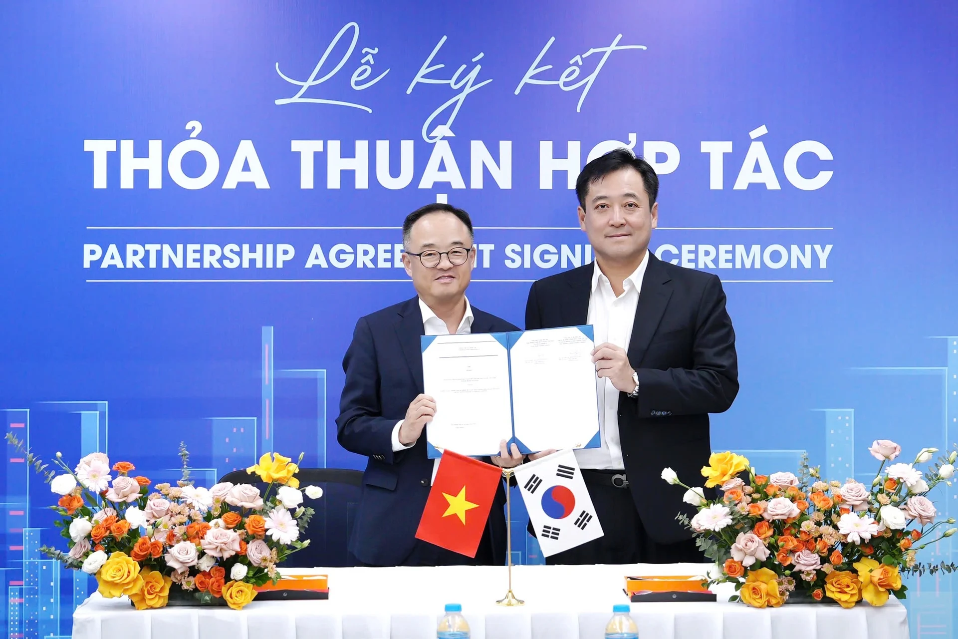 woori-bank-va-lotte-finance-ky-hop-tac-don-lan-song-tang-truong-tai-chinh-ban-le-2025